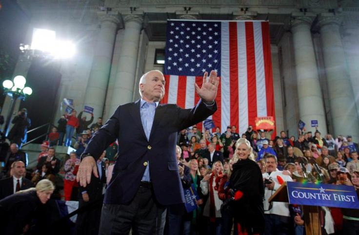 FILE PHOTO - U.S. Republican presidential nominee Senator John McCain waves to the crowd at a midnight campaign rally in Prescott